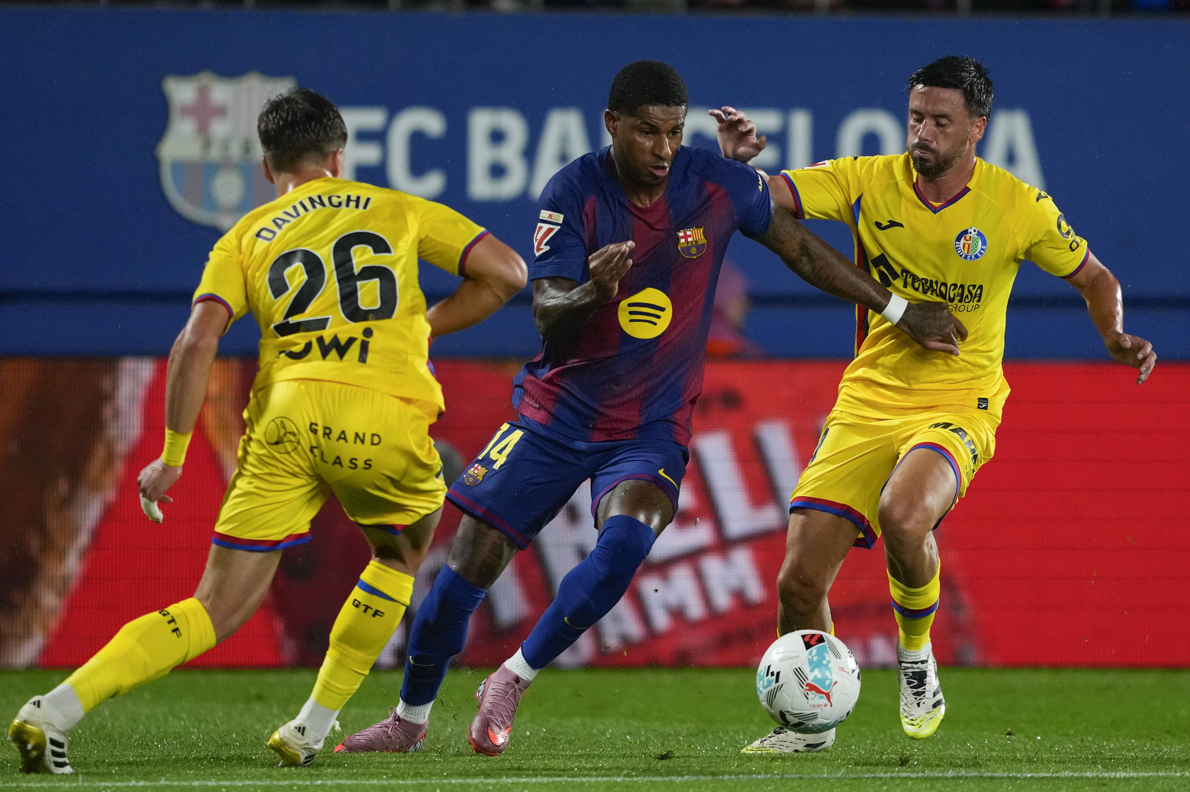 包含赫塔费球员在比赛中表现出色，夺取胜利的词条