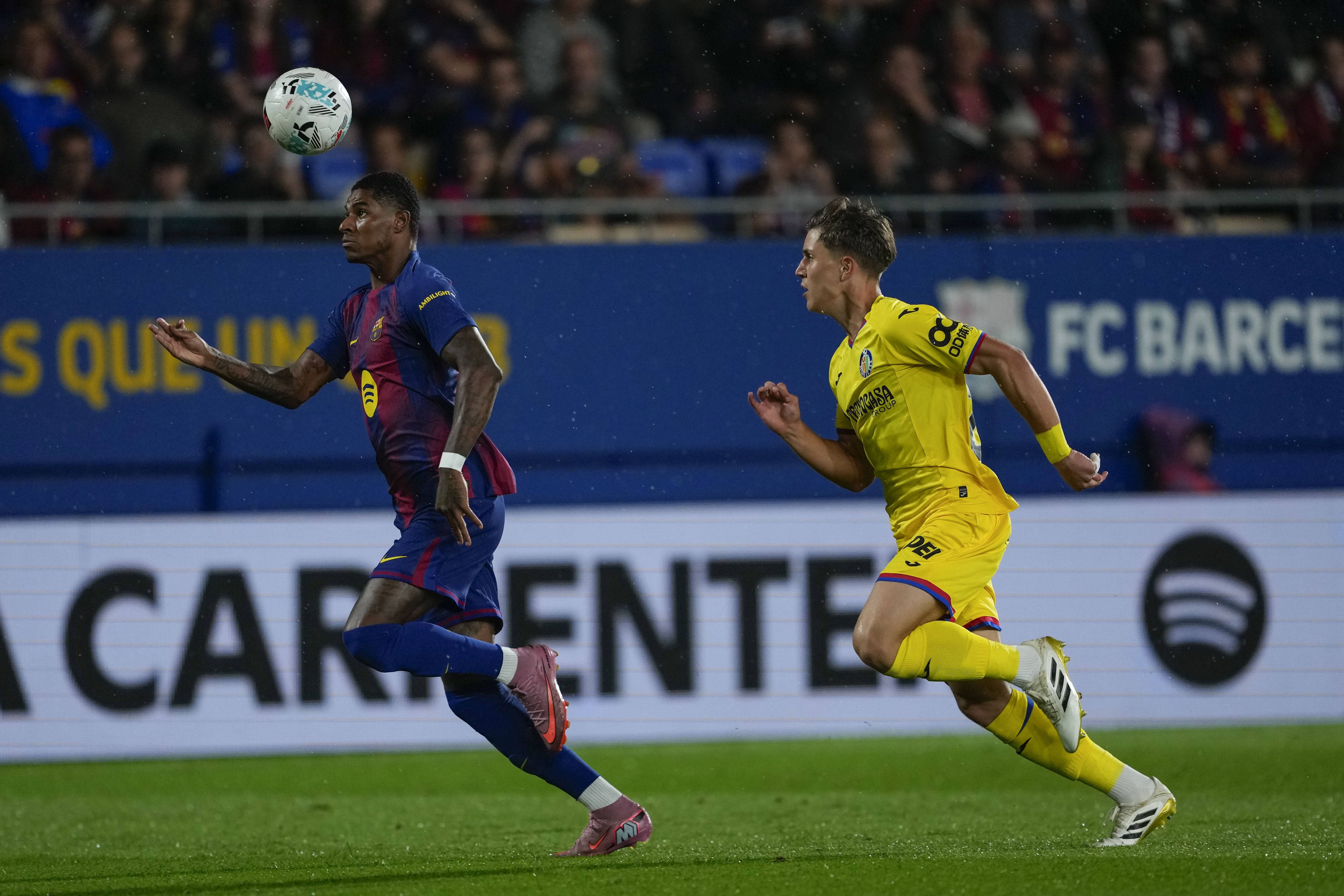 包含赫塔费球员在比赛中表现出色，夺取胜利的词条